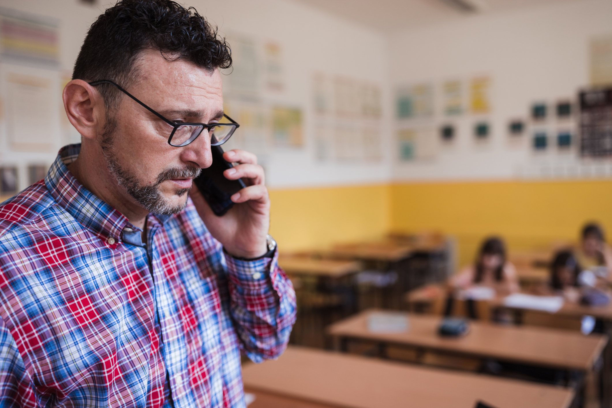 Teacher talking on cell phone
