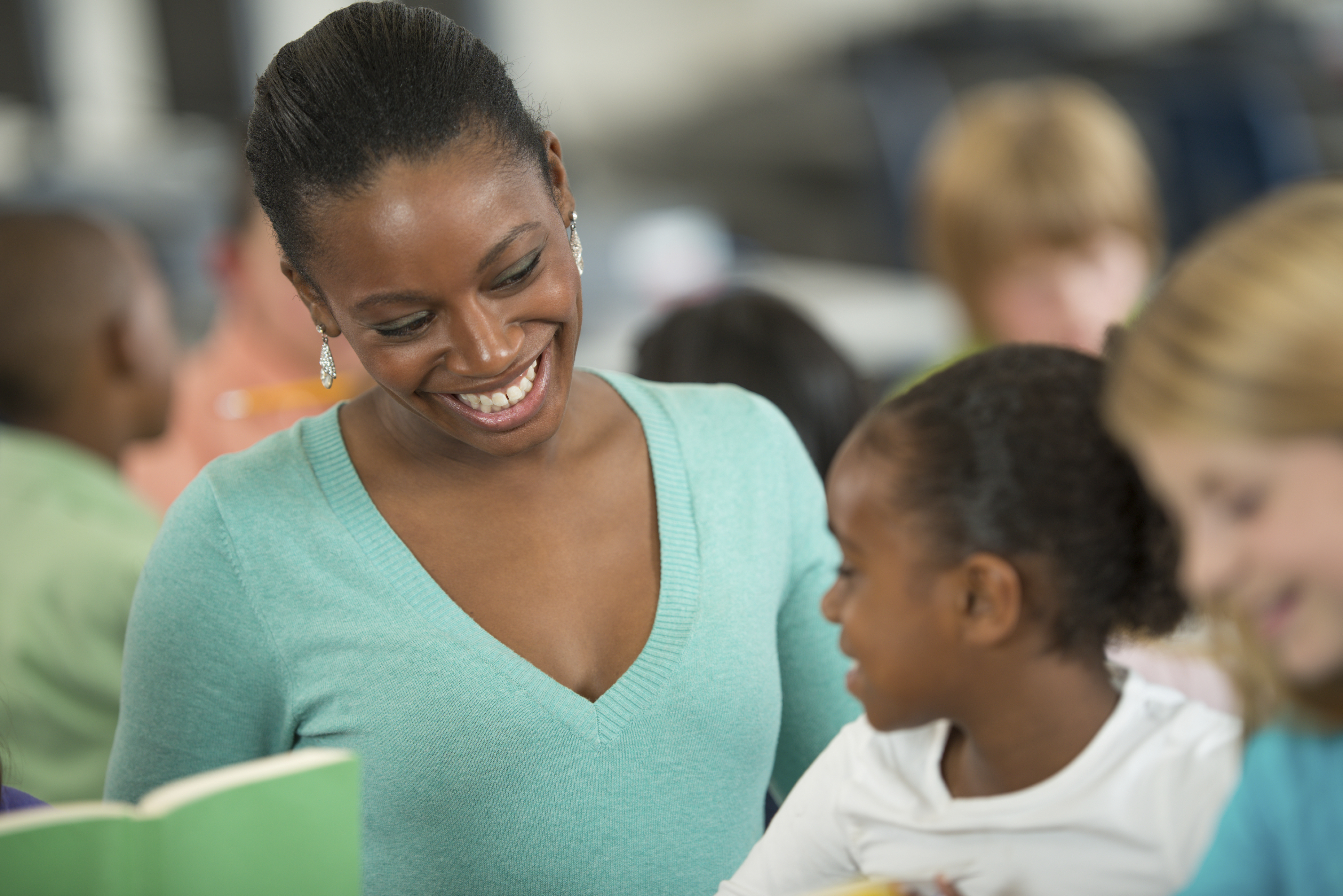 Teacher helping students