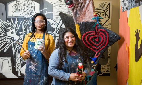 Tips for Art Educators: Teaching English Language Learners Art student in front of a mural