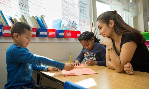 Teacher helping a small group
