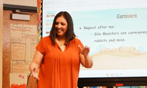 Teacher teaching the word 'carnivore'