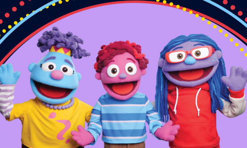 Three colorful puppets smiling
