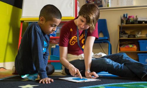 Teacher helping a student