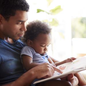 Father reading to baby