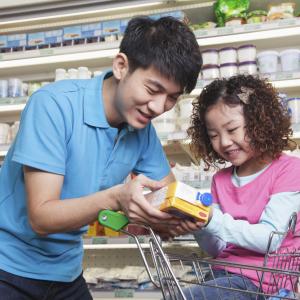 Father and daughter at grocery store