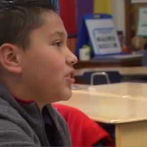 A boy talking to someone off-camera