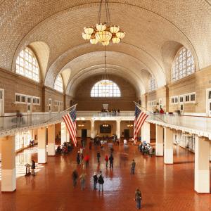 the interior of a large builing where there are American flags displayed