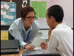teacher talking to a boy