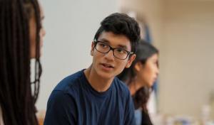 High school student talking wtih classmate