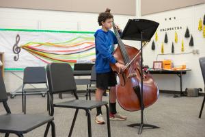 Student playing the cello