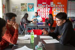 Students discussing a topic in class