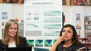 Two teachers in a meeting about biliteracy