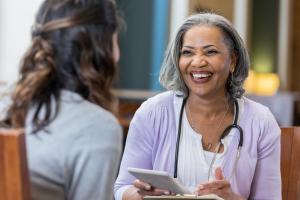 School nurse talks with a woman