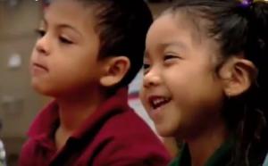 A boy and a smilling girl.