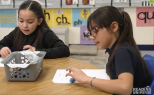Two students worknig at a desk