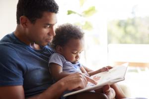 Father reading to baby