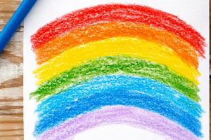 Rainbow drawing on wooden table