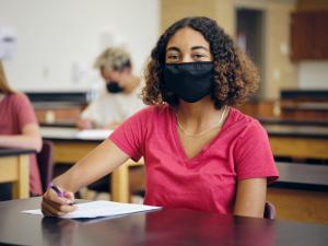 High school student wearing mask
