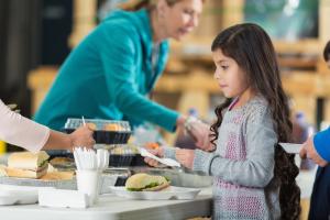 Girl at food line