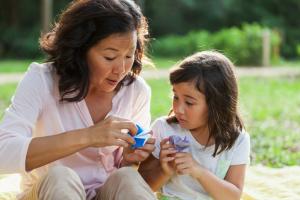 Mother and daughter doing origami