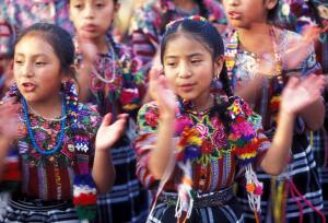 Children dance in Antigua in Guatemala in Central America