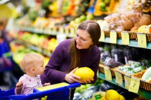 Mother and baby looking at fruit