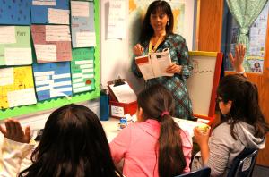 Teacher with students at lunch