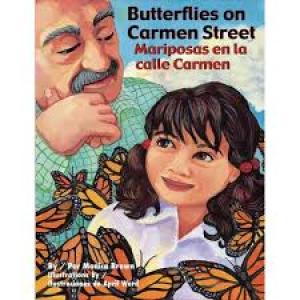 Young girl looks at butterflies with her grandfather