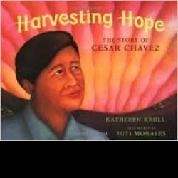 Portrait of Cesar Chavez in front of setting sun