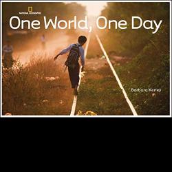 Young boy walking along railroad tracks