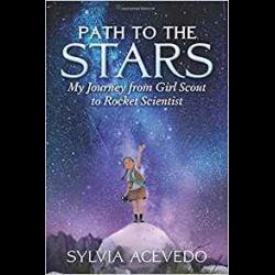Young Sylvia Acevedo looking up at nighttime sky