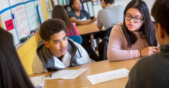 Students having a discussion at a table
