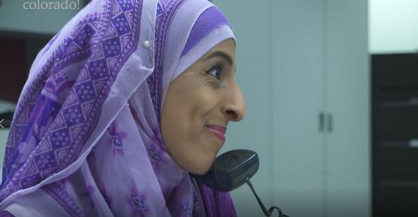 School secretary on the phone in the front office