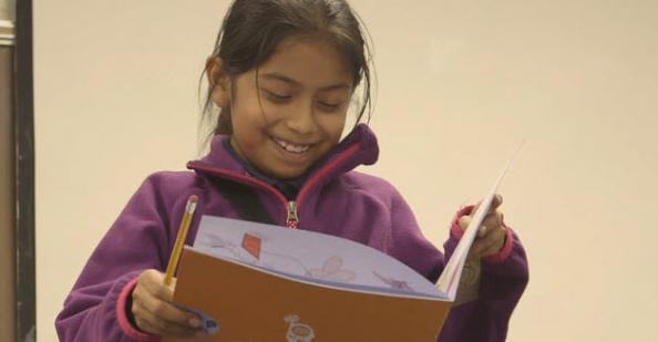 Student reading a story