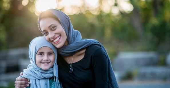 Mother and daughter in headscarves
