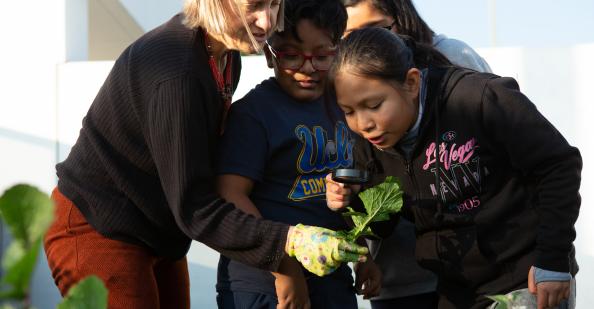 ELL Strategies for Science Instruction Teacher helping a student