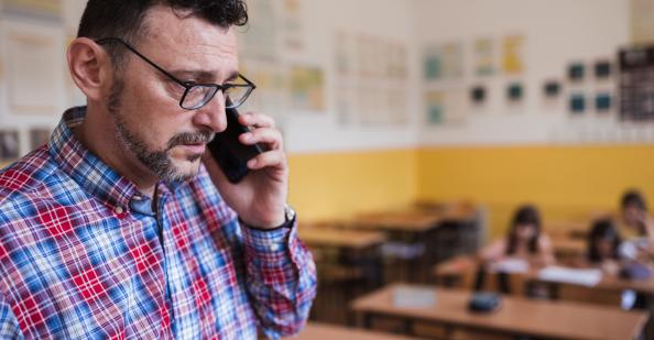 Teacher talking on cell phone