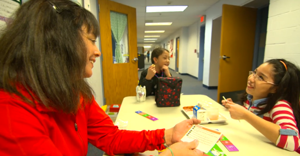 Teacher having lunch with students