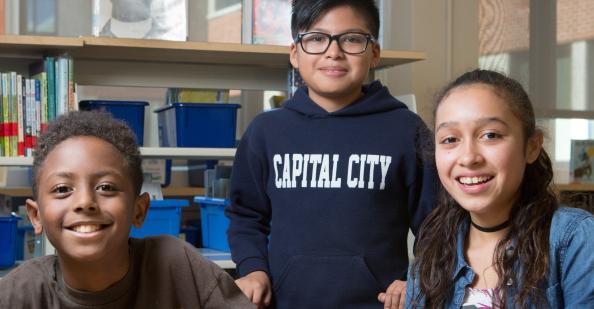 And be sure to send us an invoice for your review time Three young people in a school library