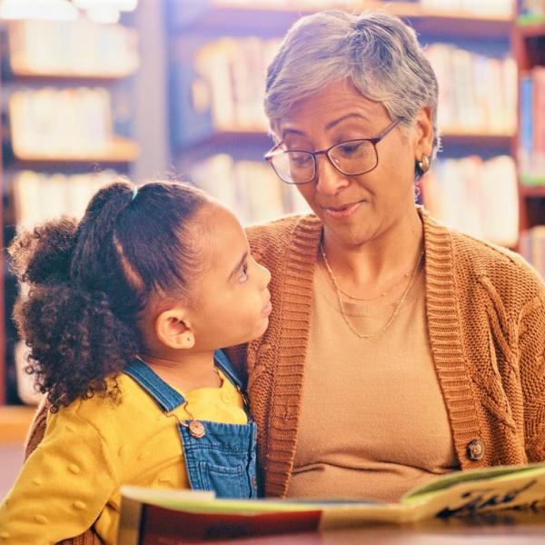 Child with grandmother in library