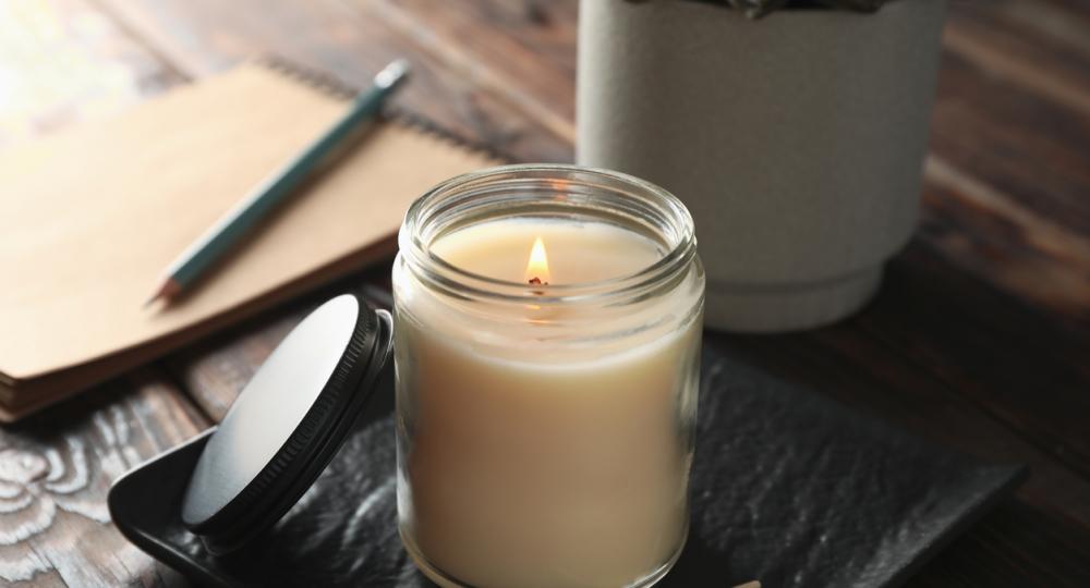 Candle near notebook